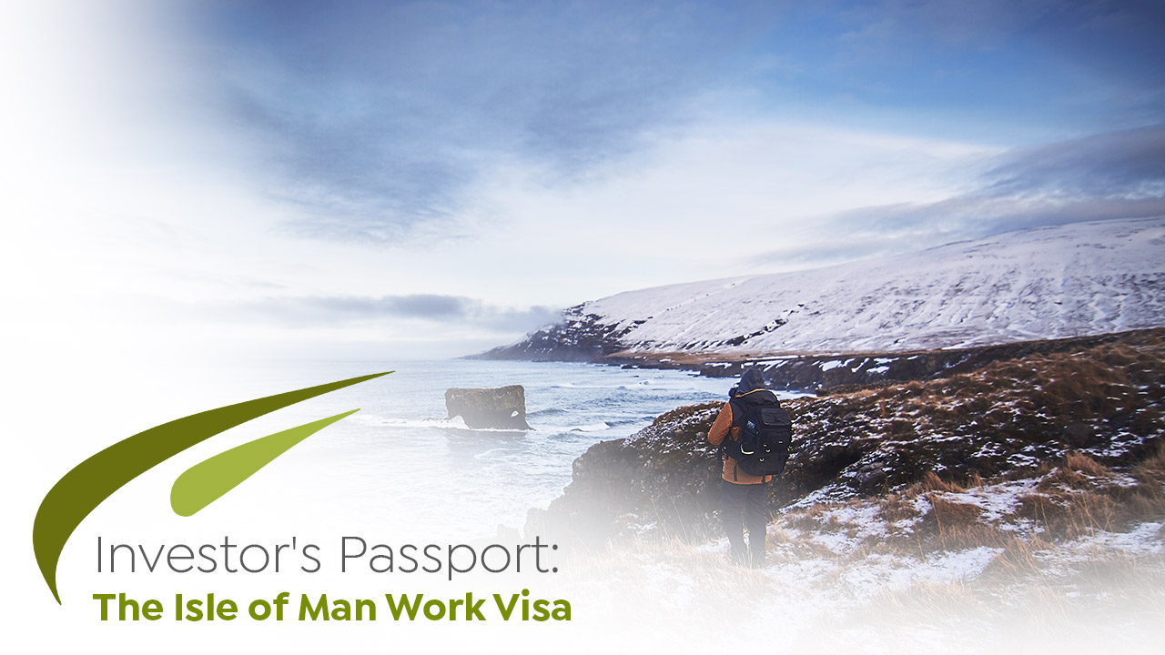 male wearing backpack jacket standing snowy hill while taking picture sea - isle of man work visa